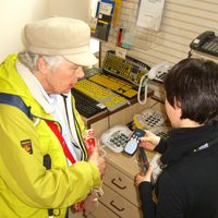 Photograph of SRSB client being shown products in the Equipment Centre