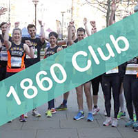 Photo of some participants at a running event with a banner going across the picture that says 1860 Club