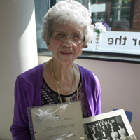 Photograph of Joyce at SRSB with her letter and photograph of the CAPITOLS