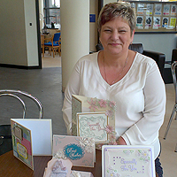 Photograph of Val with some of her cards