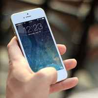 Close up photo of someone using a mobile phone