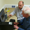 Photograph of client with SRSB IT Training Officer 