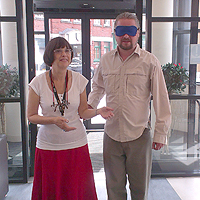 Photograph of volunteer receiving visual impairment awareness training