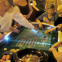 Photograph of people playing roulette at a corporate event