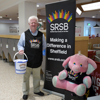 Photo of a volunteer at a store collection