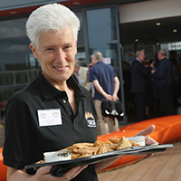 Photo of someone at an event with a tray of food