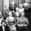 Old black and white photo of a group of residents from Overend Cottages