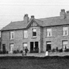 Black and white photo of the exterior of Overend Cottages