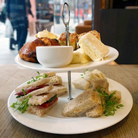 Photo of some sandwiches on tiered plates