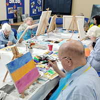 Photo of people painting in the group