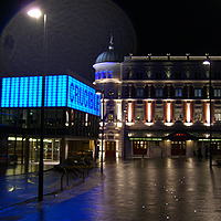 Photo of the exteriors of the Crucible and Lyceum lit up at night