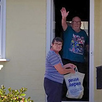 Photo of Carole picking up her shopping