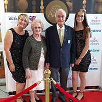 Photo of Graham at the award celebration with his family