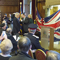 Photo of Graham receiving the Legion D'Honneur at the Town Hall