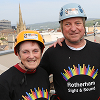 Photo of Mick and his wife Sue at the abseil raising funds for our charity