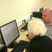 Photograph of SRSB client receiving computer training