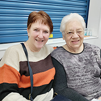 Photo of two ladies smiling at the camera