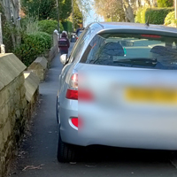 Car parked on a pavement