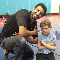 Photo of one of our young clients with an instructor at a breakdancing session