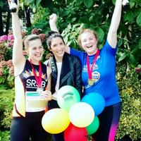 Photograph of Aisling with her friends at the end of the race