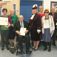 Photograph of SRSB volunteers with the High Sheriff