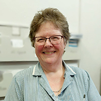 Photo of Joanne smiling at the camera