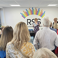 Photo of Joanne speaking at the event