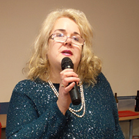 Photo of Mel when she sang at our Christmas Lunches in 2019