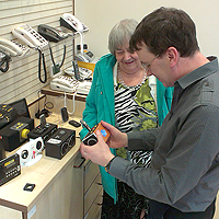 Photograph of SRSB client being shown products in the Equipment Centre