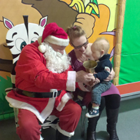 Photo of mum and child at a previous Christmas Party