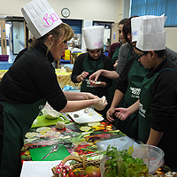 Photograph of youth club holding a cookery session