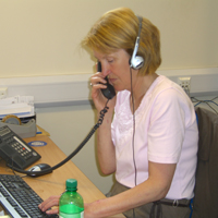 Photograph of Tele-Contact volunteer making a telephone call