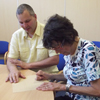 Photograph of client receiving braille training