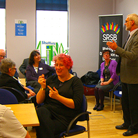 Photograph of SRSB staff presenting to a community group