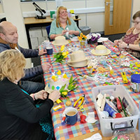 Photo of people working in the craft group 