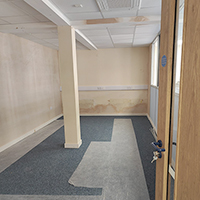 Photo of a room with new carpet in the room with fresh plaster on the walls the room is empty