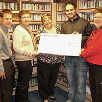 Photograph of cheque presentation