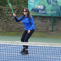 Photo of someone playing tennis