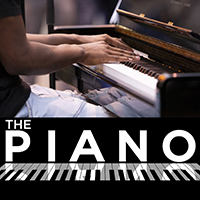 Photo of some hands posied above some piano keys with the words The Piano underneath