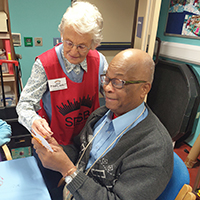 Photo of two people chatting in the craft group